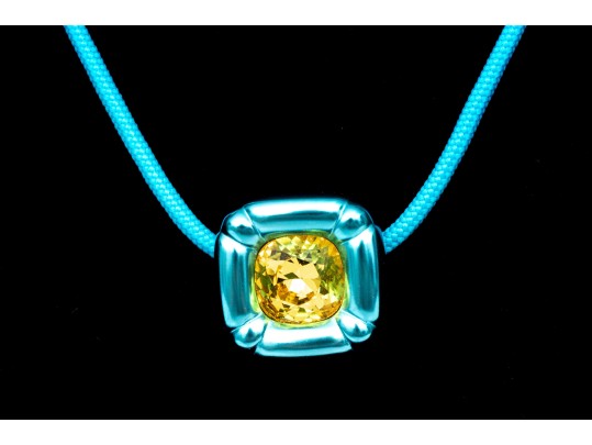 Swarovski Crystal Contemporary Blue Metallic And Cord Necklace With Yellow Crystal Center