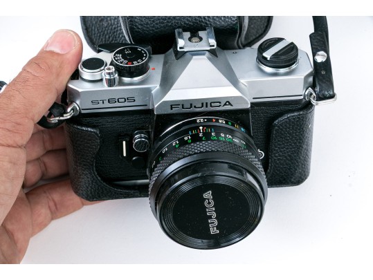 Pentax MX And Fujica ST605 Cameras, Two Lenses, And Binoculars