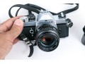 Pentax MX And Fujica ST605 Cameras, Two Lenses, And Binoculars