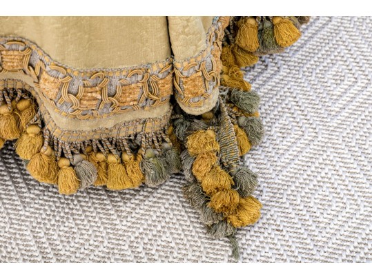 Decadent Velvet Upholstered Ottoman With Tassel Trim