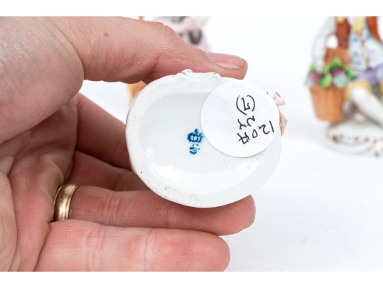 Four Continental Hand-painted Porcelain Figures