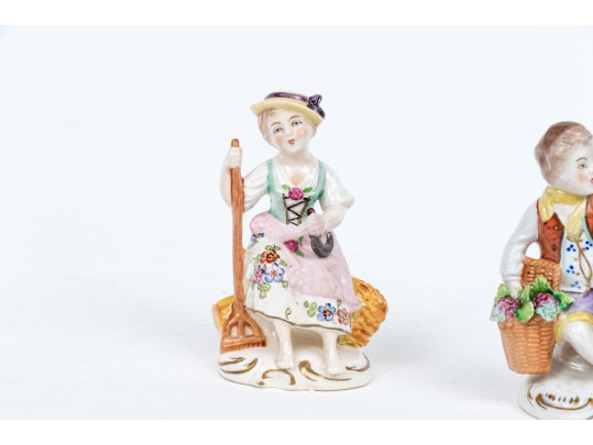 Four Continental Hand-painted Porcelain Figures