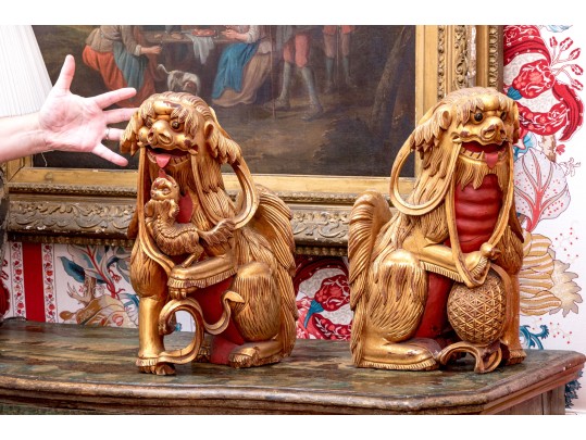 Pair Of Asian Carved, Gilt, And Paint Finished Foo Dogs