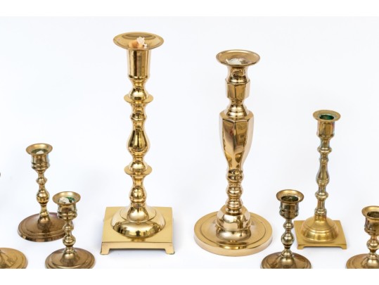 Assembled Collection Of Ten Brass Candlesticks And Candles