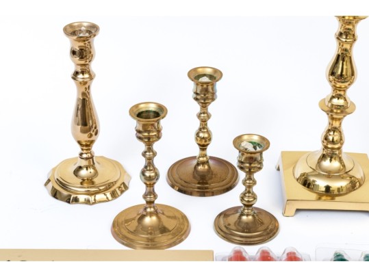 Assembled Collection Of Ten Brass Candlesticks And Candles