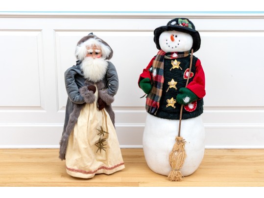 Festive Snowman And Wooden Figure Of Santa