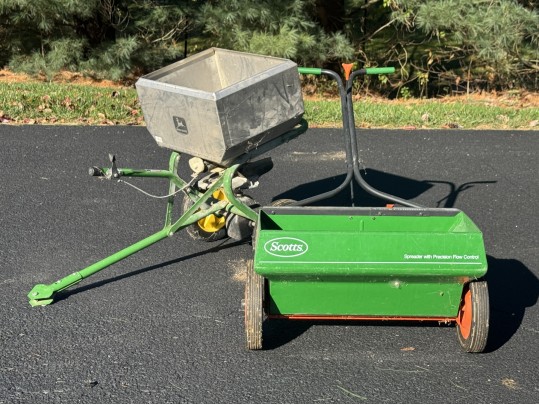 Two Seed Spreaders Including A John Deer Tractor Attachment 