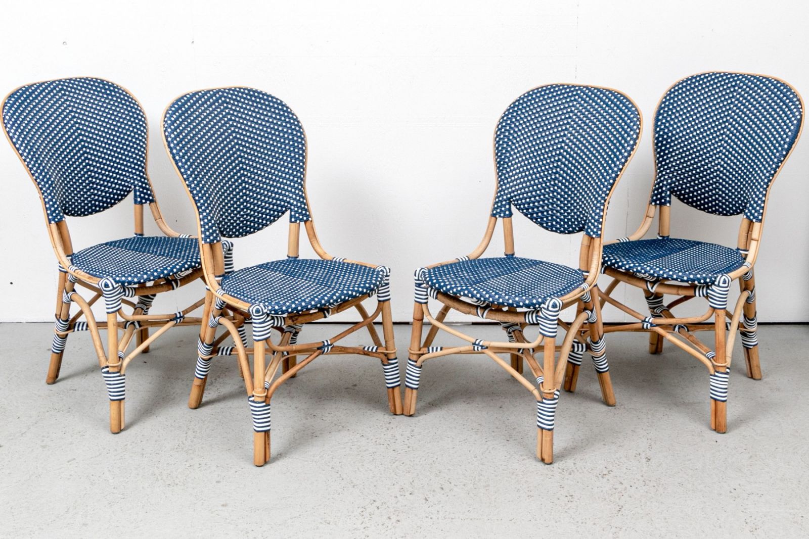 SET OF FOUR FRONTGATE WOVEN VINYL & RATTAN CHAIRS
