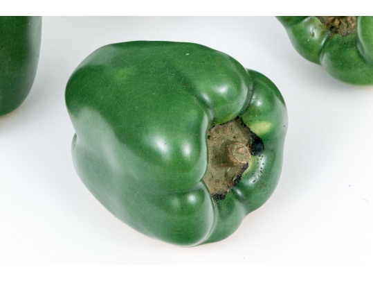 Four Naturalistic Glazed Ceramic Green Pepper Form Casters