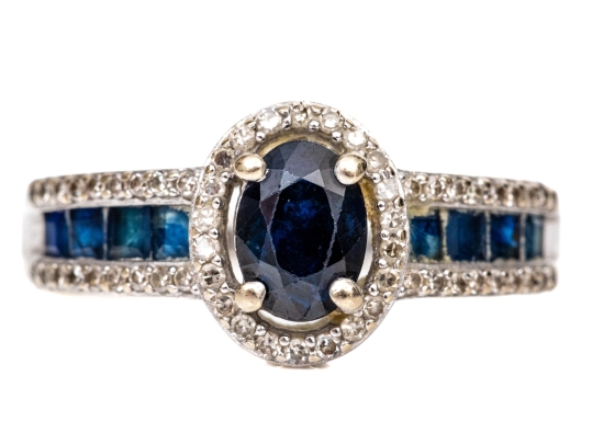 14k White Gold Oval And Calibre Sapphire And Diamond Halo Ring, App. 0.15 TCW, Size 7