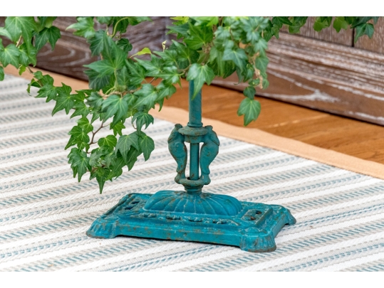 Decorative Antiqued Plant Stand With Ivy Plant In Woven Planter