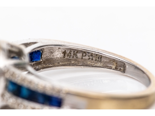 14k White Gold Oval And Calibre Sapphire And Diamond Halo Ring, App. 0.15 TCW, Size 7