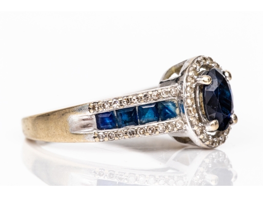 14k White Gold Oval And Calibre Sapphire And Diamond Halo Ring, App. 0.15 TCW, Size 7