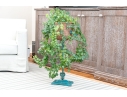 Decorative Antiqued Plant Stand With Ivy Plant In Woven Planter