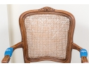 Carved Fruitwood And Cane Back Fauteuil